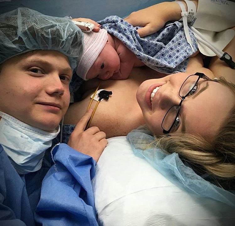 Tommy Kocher (12) and Sadie Fletcher (12) with newborn daughter Adelynn Kocher. 