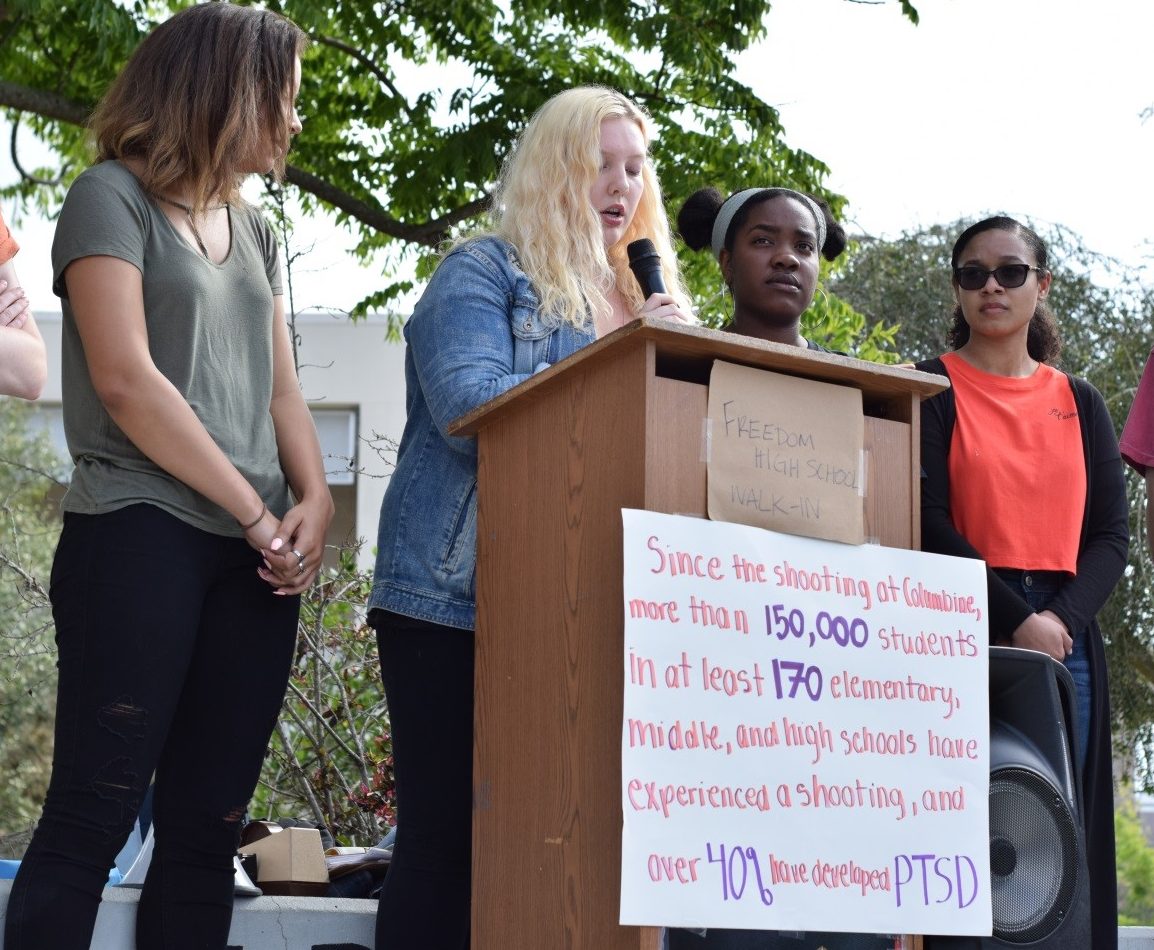 From left to right: Grace Duppins, 12, Alexis Leer, 12, Elois Hannah, 11, and Cathryn Boga, 11. Alexis gives the first speech of the rally. She told the stories of Florida students and children killed in gun violence incidents.